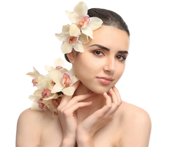 Mujer bonita con orquídea — Foto de Stock