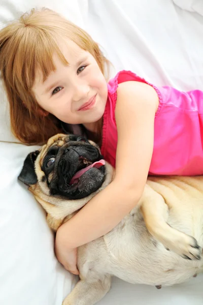 Girl and cute pug — Stock Photo, Image