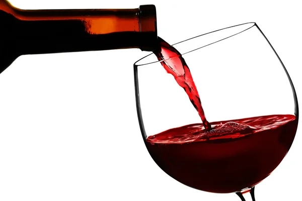 Red wine pouring in glass — Stock Photo, Image