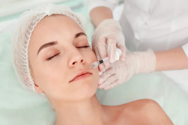 Beautiful woman getting an injection — Stock Photo, Image