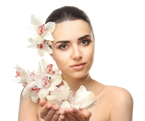 Pretty woman with orchids — Stock Photo, Image