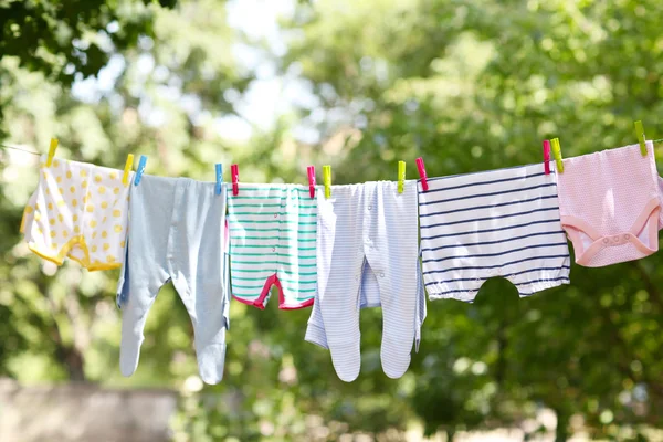 Baby clothes hanging — Stock Photo, Image