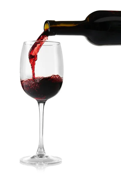 Red wine pouring into wine glass — Stock Photo, Image