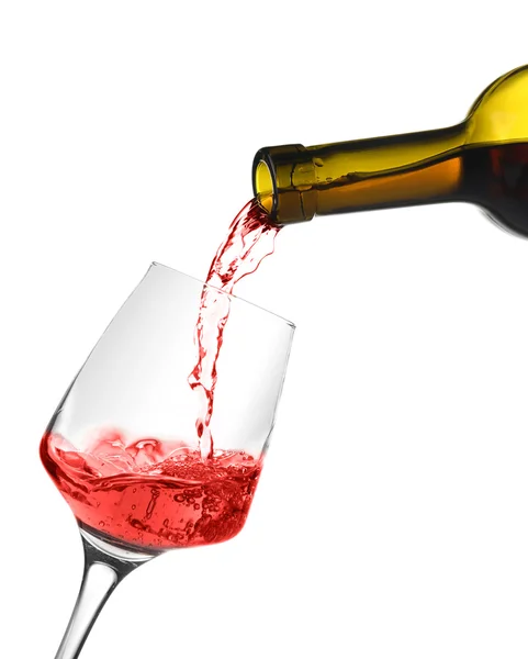 Červené víno nalévající se do sklenice vína — Stock fotografie