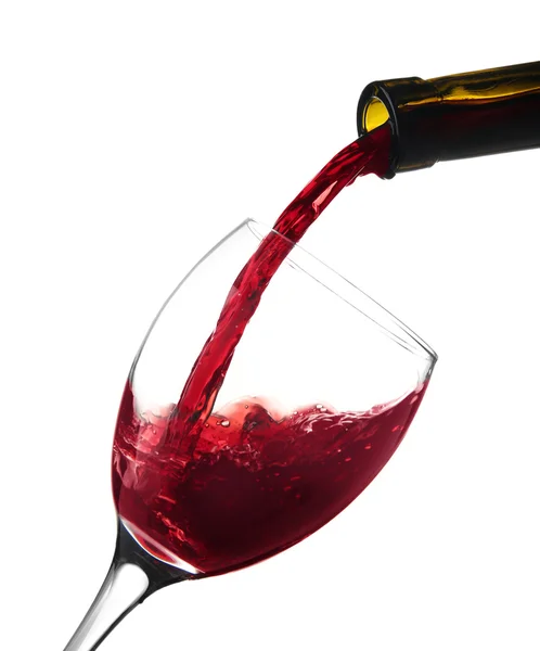 Red wine pouring into wine glass — Stock Photo, Image