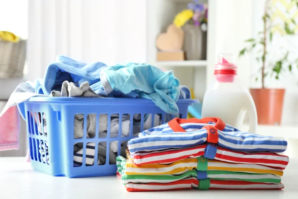 Clothes in plastic basket — Stock Photo, Image