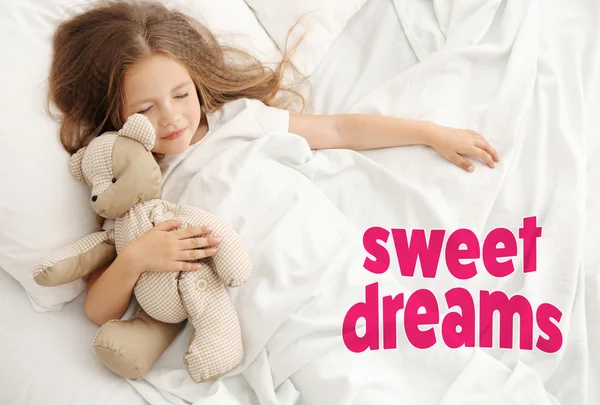 Girl sleeping with teddy bear — Stock Photo, Image