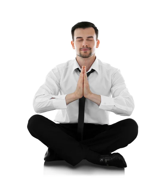 Бизнесмен расслабляется в позе медитации — стоковое фото
