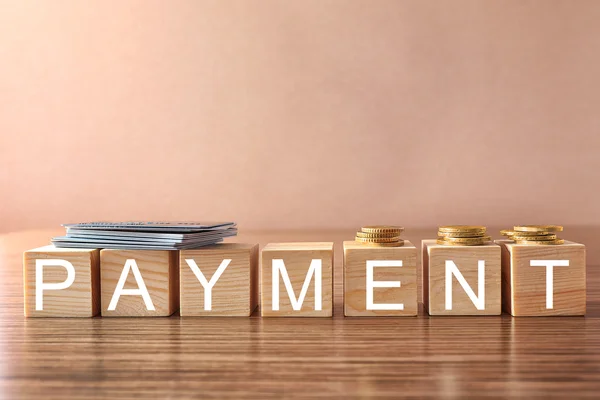 Cubos de madera con palabra Pago — Foto de Stock