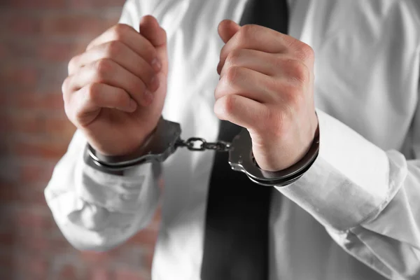 Man hands in handcuffs — Stock Photo, Image