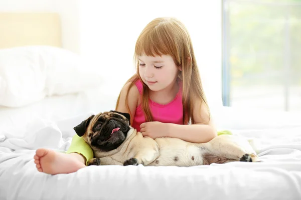 Little girl and pug — Stock Photo, Image