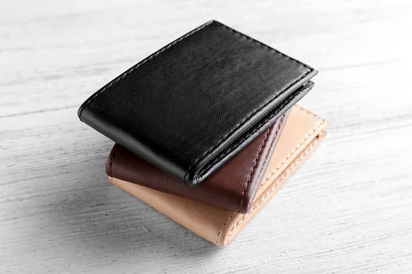 Leather wallets on wooden background — Stock Photo, Image