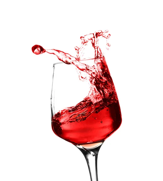 Glass of red splashing wine — Stock Photo, Image