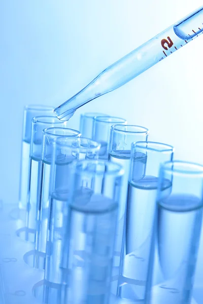 Pipette dropping sample — Stock Photo, Image