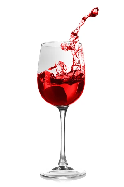 Glass of red splashing wine — Stock Photo, Image