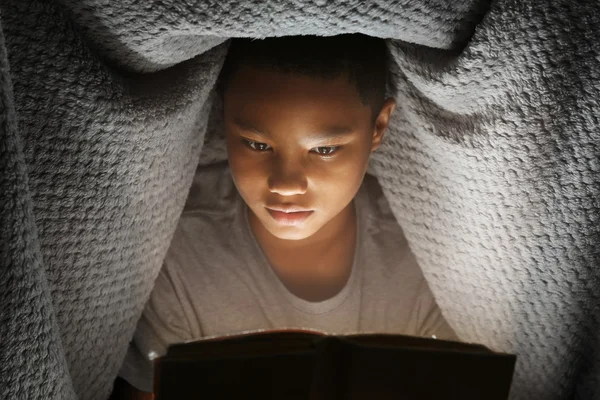 Cute boy reading book — Stock Photo, Image