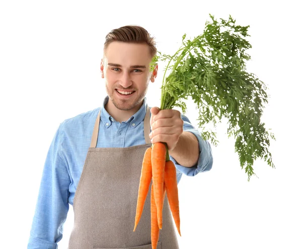 Bello uomo mangiare carota — Foto Stock