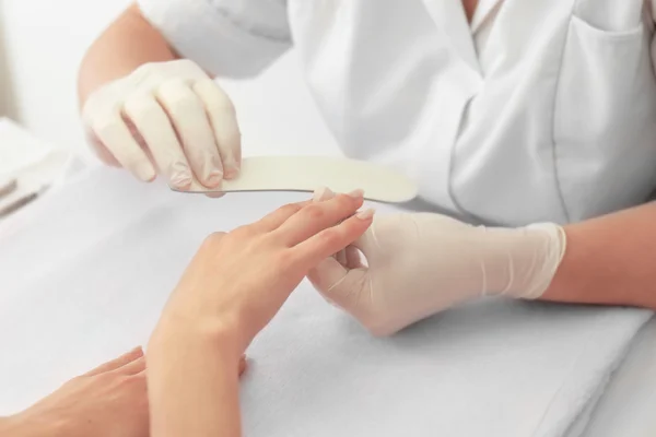 Woman getting manicure — Stock Photo, Image