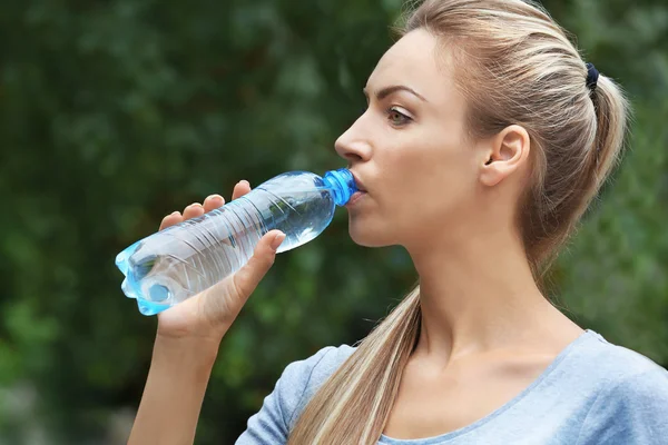 Girl drinking water Stock Picture