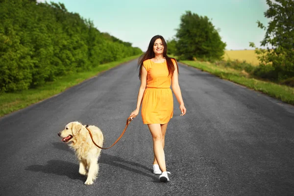 Girl with cute retriever — Stock Photo, Image