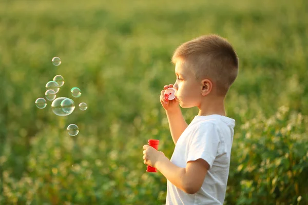 Little boy with bubbles Stock Image