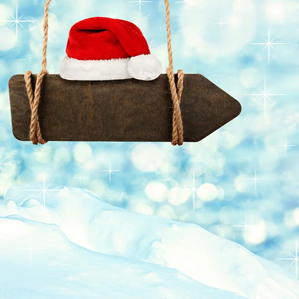 Wooden sign and santa hat — Stock Photo, Image