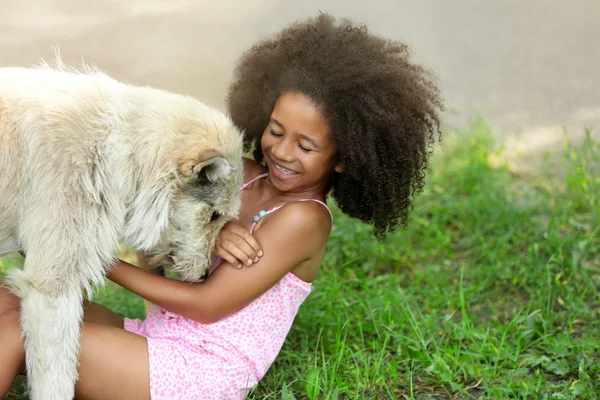 African American girl with dog — Stock Photo, Image