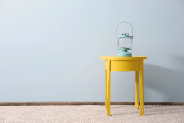 Bedside table with lantern — Stock Photo, Image