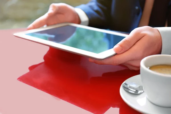 Businessman with coffee and tablet — Stock Photo, Image