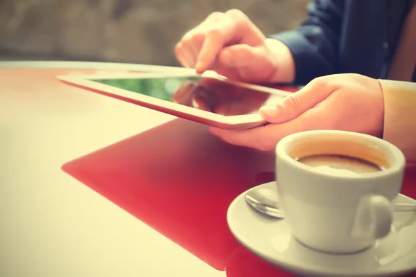 Businessman with coffee and tablet — Stock Photo, Image