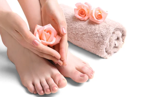 Female feet with flowers — Stock Photo, Image