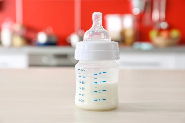Feeding bottle with baby milk — Stock Photo, Image