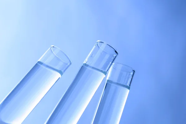 Test tubes on background — Stock Photo, Image