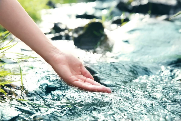 Woman pouring water — Stock Photo, Image