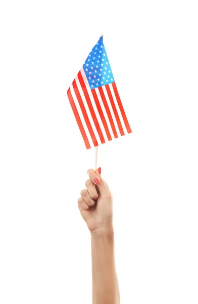 Mano femenina sosteniendo bandera americana — Foto de Stock