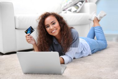 young woman using credit card