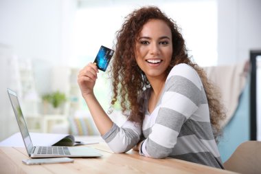 young woman using credit card