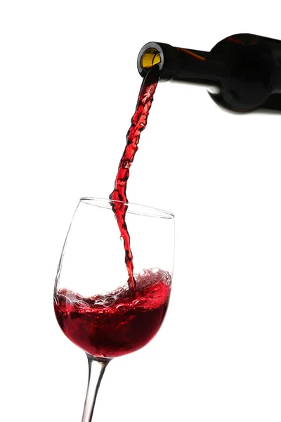 Red wine pouring into glass — Stock Photo, Image