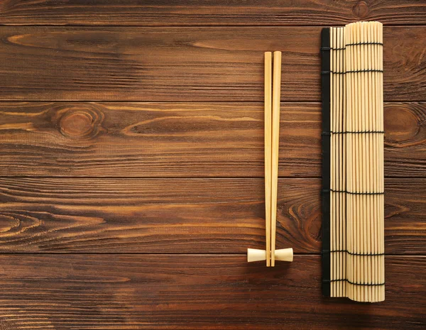 Wodden chopsticks on table — Stock Photo, Image