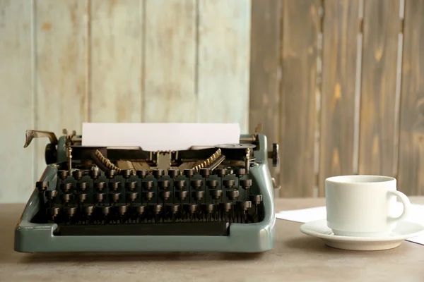 Old typewriter and cup of coffee — Stock Photo, Image