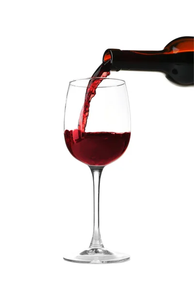 Red wine pouring into glass — Stock Photo, Image