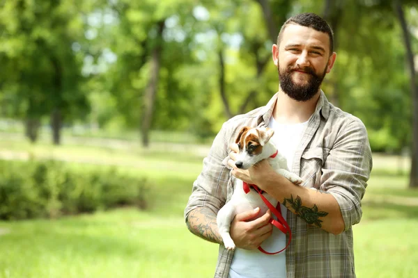 Man with dog in park — Stock Photo, Image