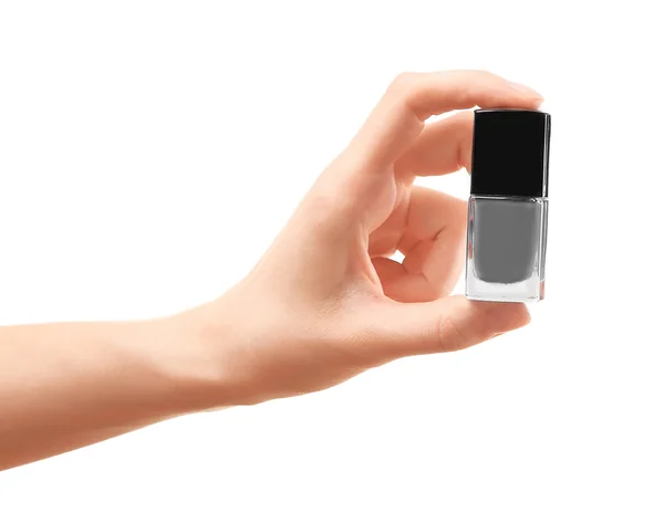 Mano sosteniendo esmalte de uñas — Foto de Stock