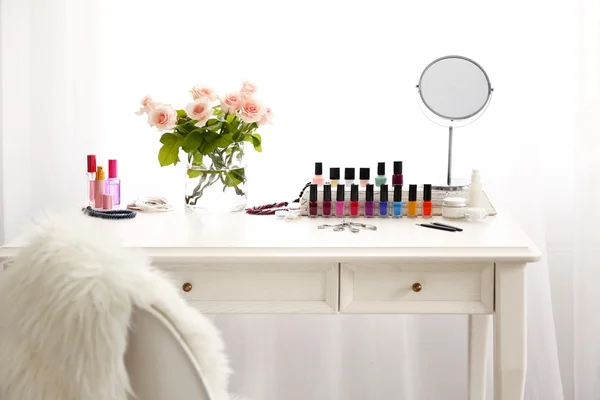 Manicure set on light dressing table — Stock Photo, Image