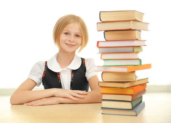 Smiling girl with many books — Stock Photo, Image