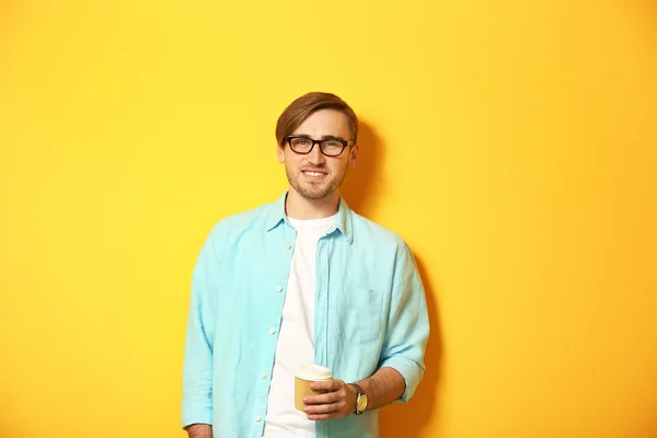 Young handsome man with a cup of coffee — Stock Photo, Image