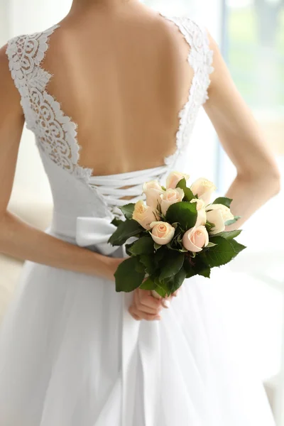 Bride holding wedding bouquet — Stock Photo, Image