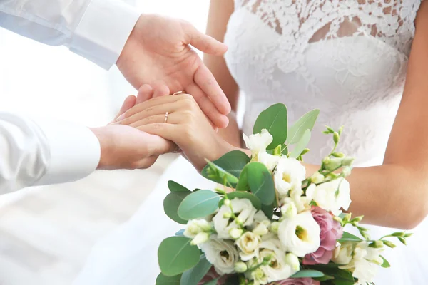 Groom and bride holding hands — Stock Photo, Image