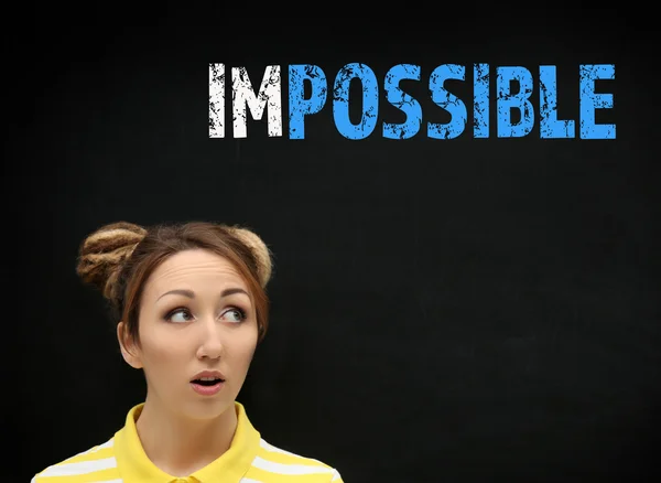 Young Woman Blackboard Word Impossible Transformed Possible — Stock Photo, Image