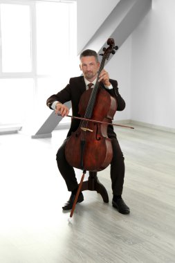 Man playing cello clipart